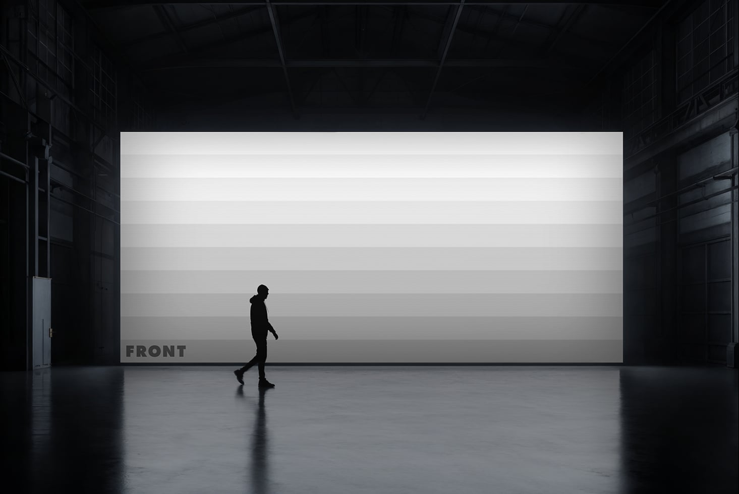 Jogger moving past white billboard in concrete warehouse, dramatic overhead lighting