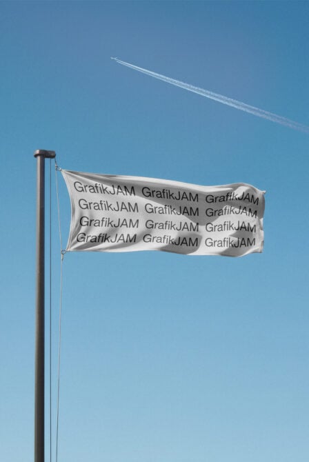 White flag mockup blowing in wind on metal pole with text overlay, blue sky backdrop