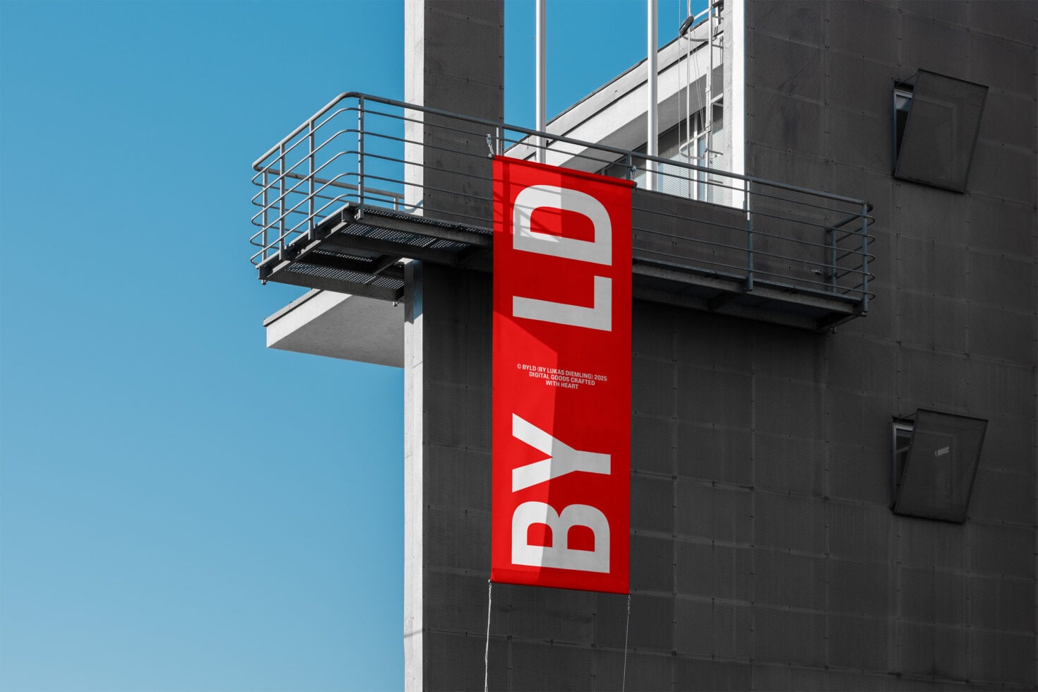 Bold red vertical banner with white text on building exterior