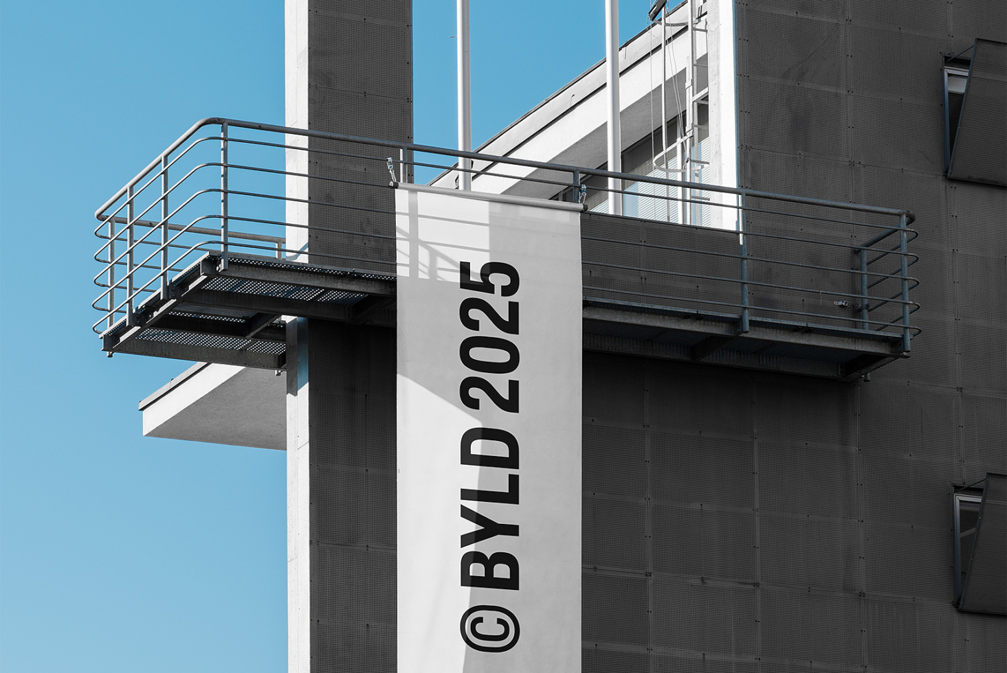 Vertical banner mockup on building ledge with black text white background