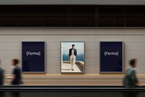 Three framed artworks centered on gallery wall with navy panels on sides, blurred figures below