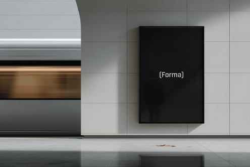 Blank black frame mockup mounted on light concrete wall panel