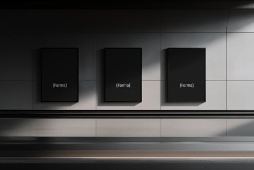 Three empty black frame mockups mounted on minimal gallery space
