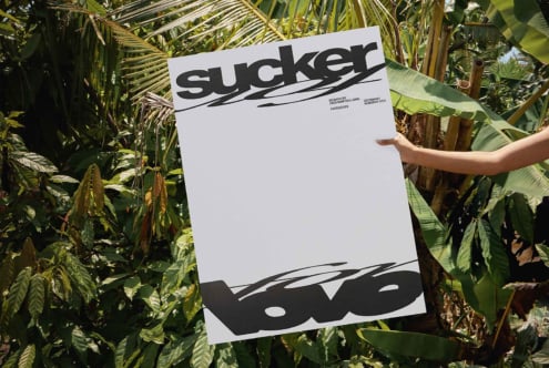 Sucker letterhead mockup showing black logo design among dense tropical foliage