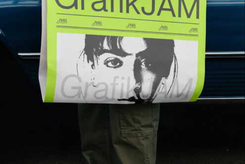Neon yellow poster mockup with black portrait image held by person against blue car