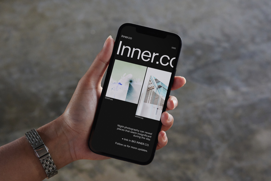 Inner.co dark mode site on phone displaying photo gallery with mountain images