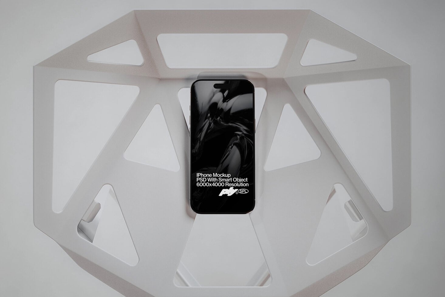 Phone displaying motion design inside white octagonal display box from above