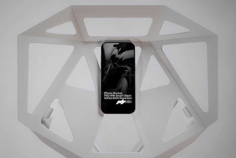 Phone displaying motion design inside white octagonal display box from above