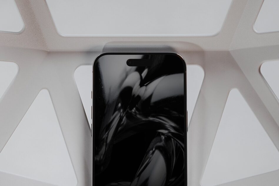 Phone with dynamic motion blur screen centered in white geometric frame overhead view