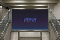 Underground transit billboard with dark blue background lit by spotlights