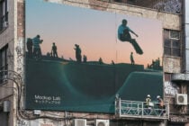 Skateboarder silhouette displayed on oversized billboard at sunset