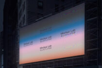 Large outdoor billboard mockup with gradient sunset colors, displaying repeated "Mockup Lab" text in English plus Japanese characters
