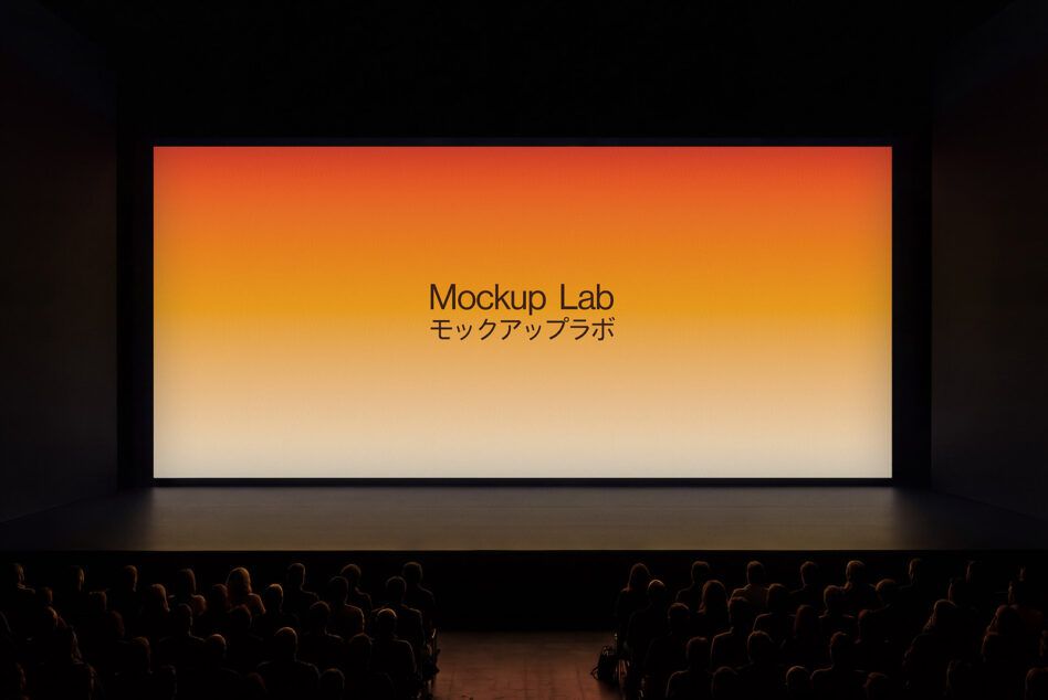 Theater screen displaying orange to cream gradient with centered text, audience visible