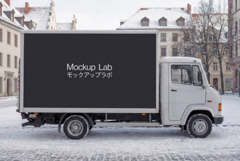 White truck cargo box with dark background, Mockup Lab text bilingual displayed centered