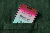 Phone in green ribbed fabric pocket showing pink to mint gradient screen