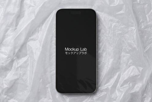 iPhone 14 Pro with black screen displaying Mockup Lab text on white textured background