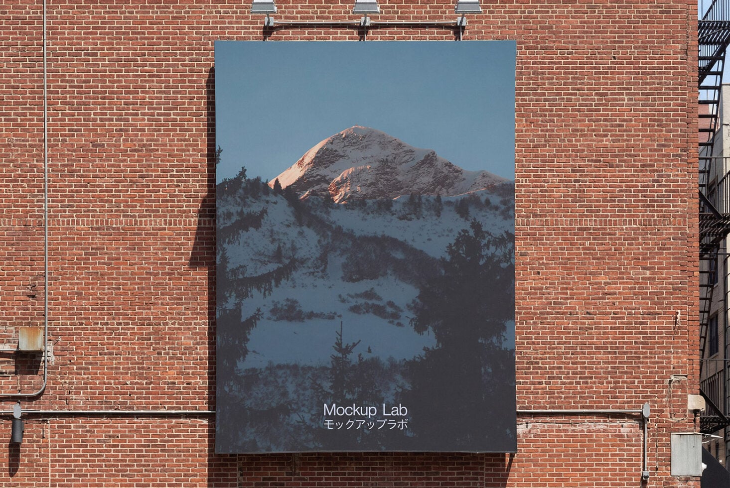 Large poster on exposed brick showing snow covered mountain landscape