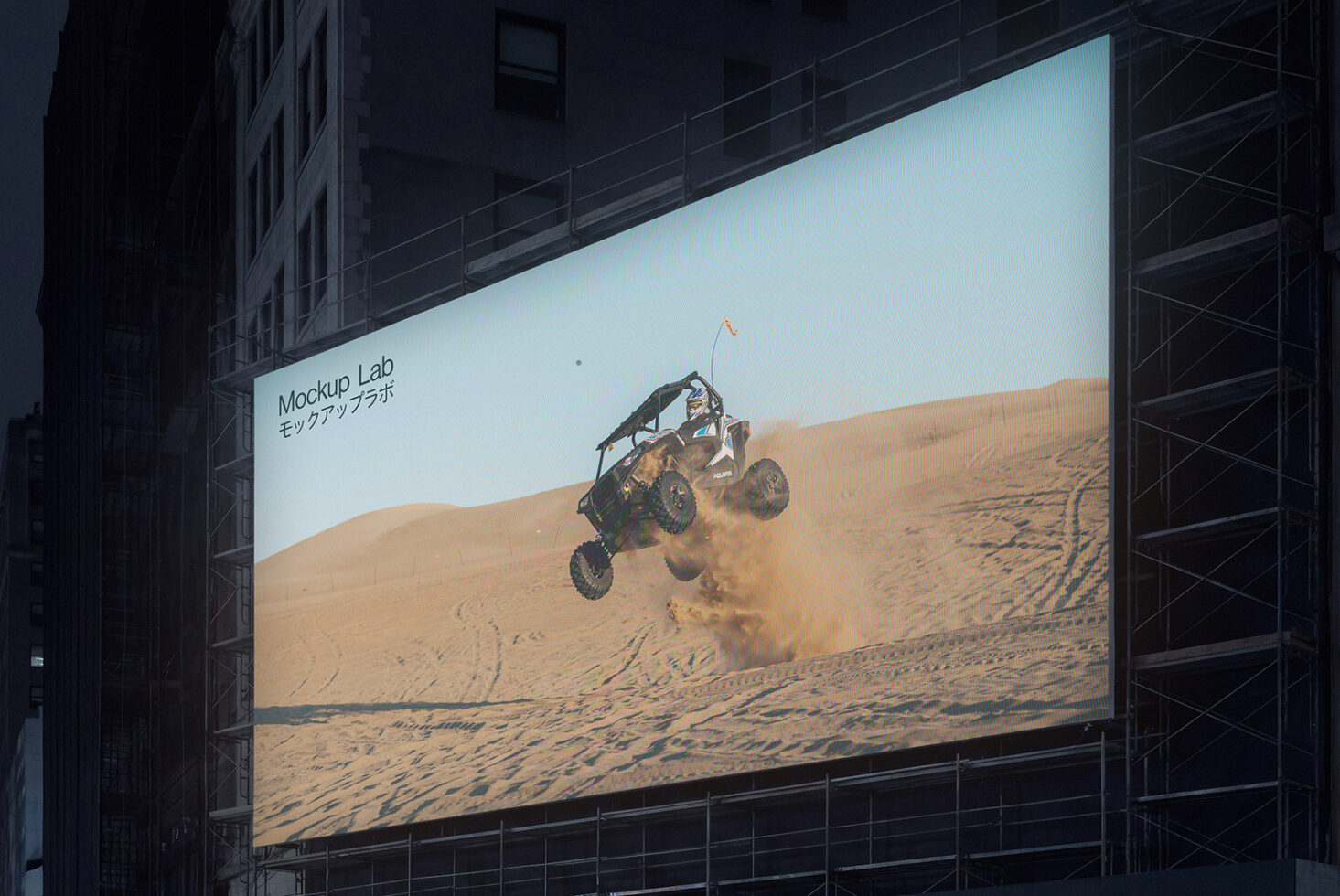 Wide urban LED display with soft gradient colors, repeated text pattern at dusk