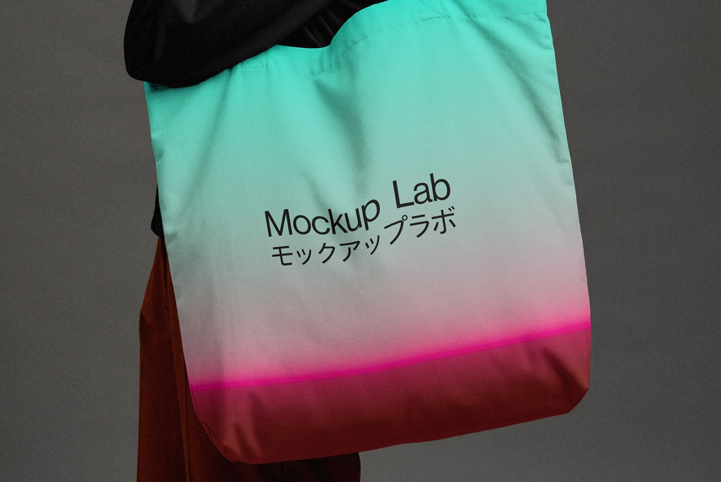 Gradient tote bag mint to magenta with black text on shoulder