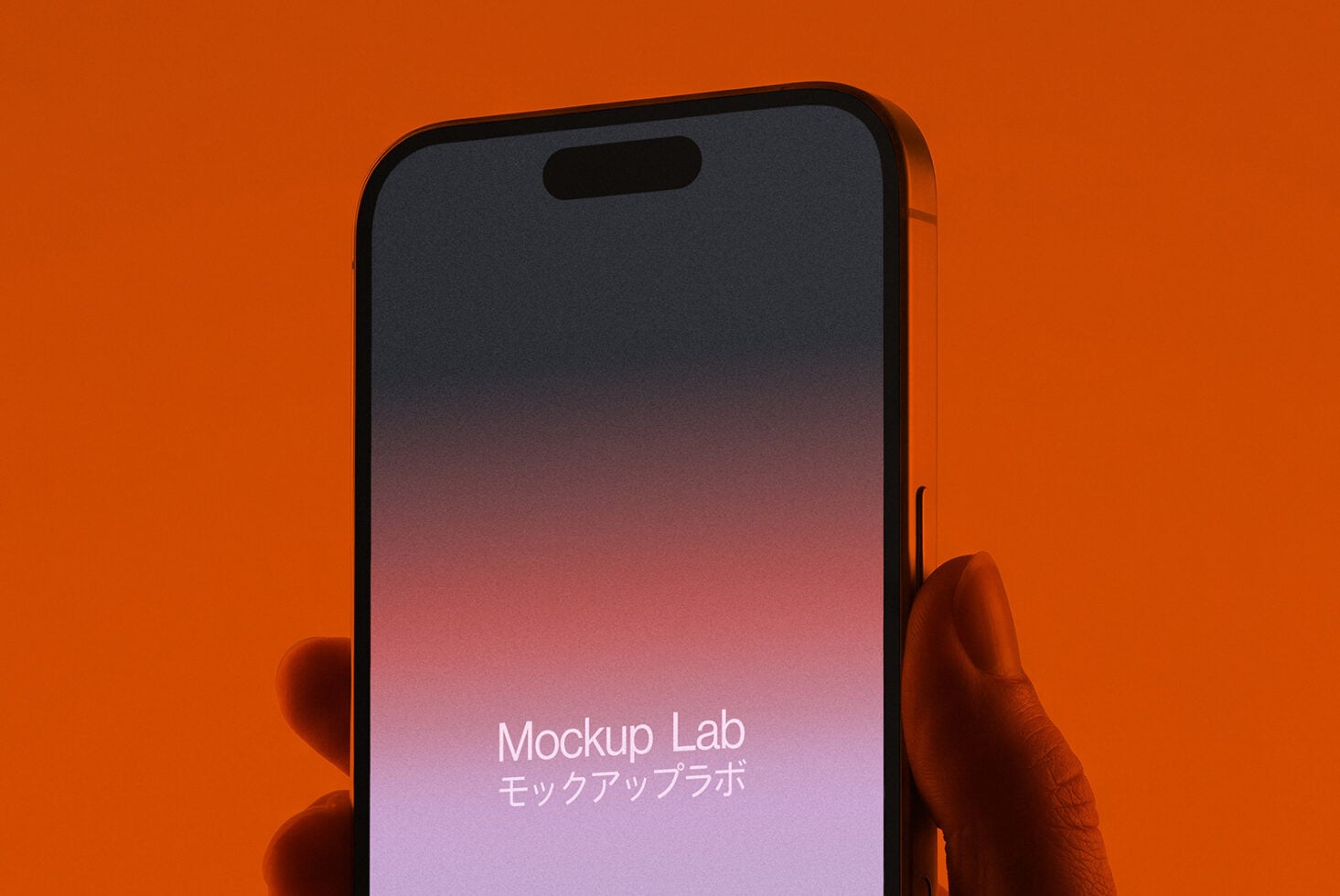 Person holding phone with pink gradient display against orange backdrop