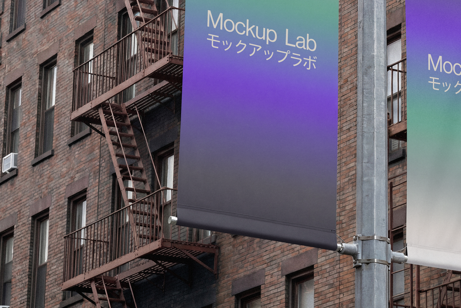 Street banner on brick building with purple to teal gradient showing Mockup Lab