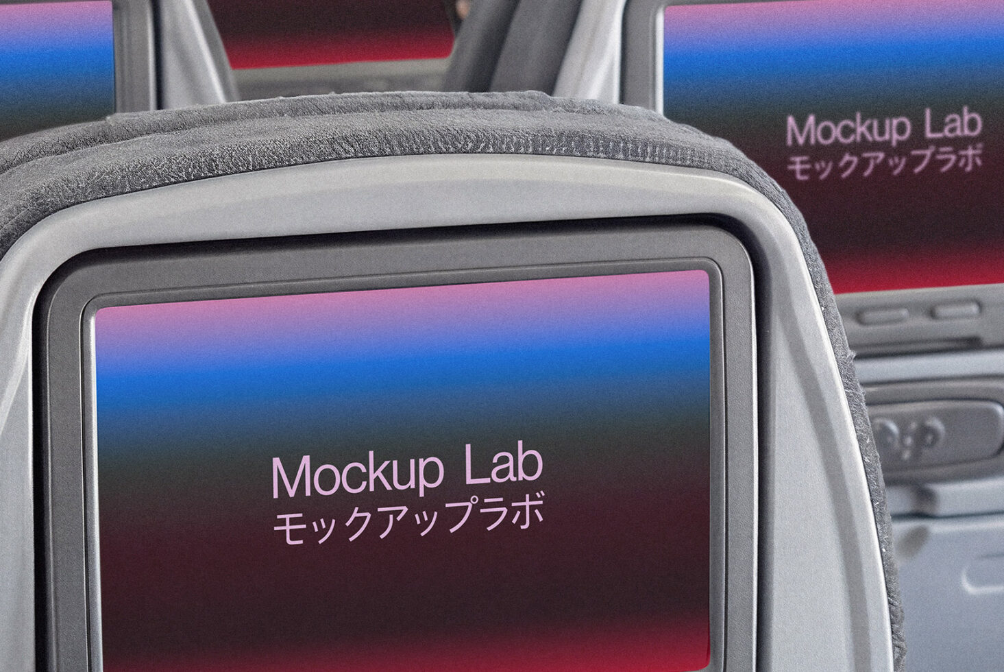 Close-up of airplane seat-back screen showing gradient display with text overlay