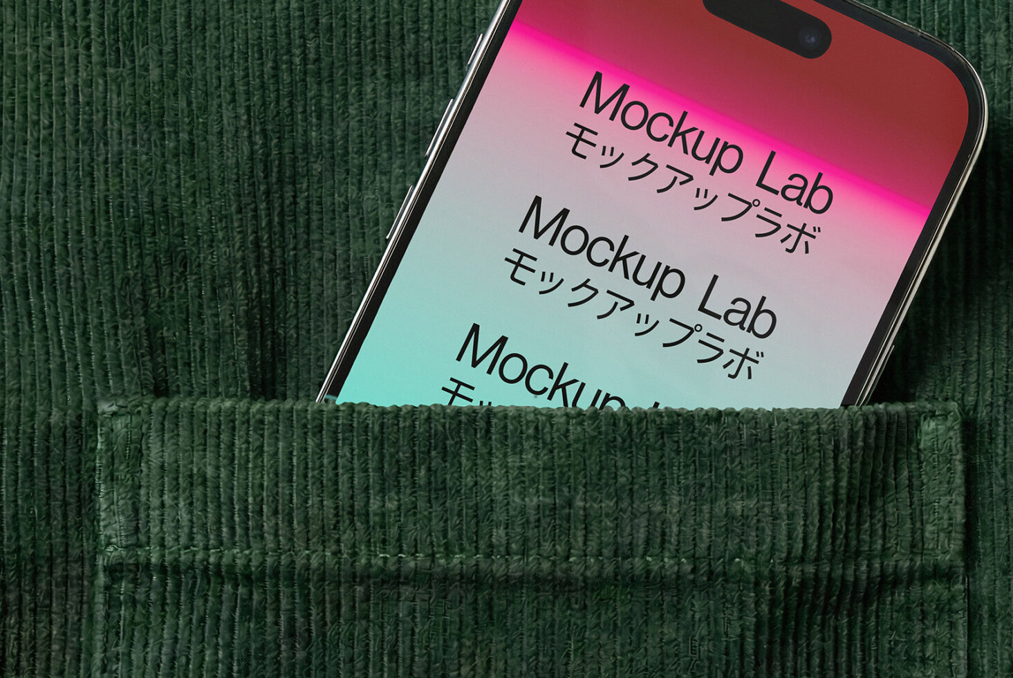 Phone in green fabric pocket showing pink cyan gradient text screen