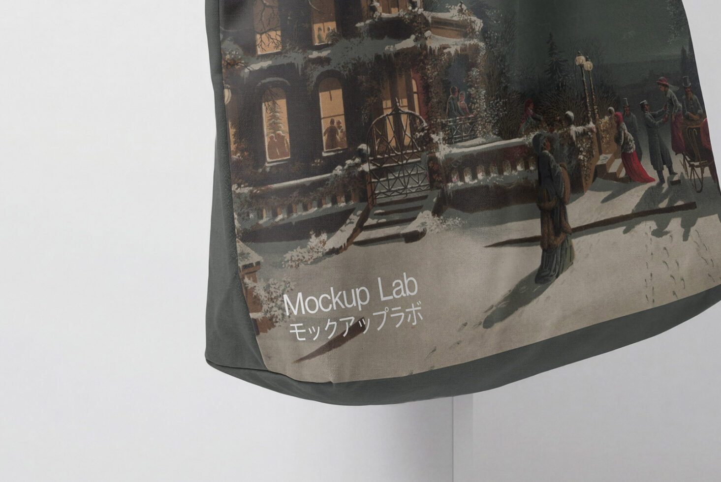Tote bag detail showing Mockup Lab text with snowy village scene print