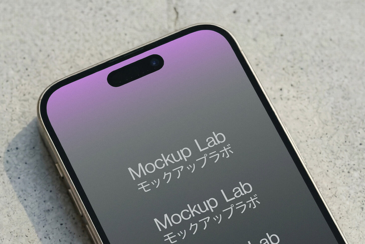 Phone on speckled concrete with purple gradient screen fading to gray