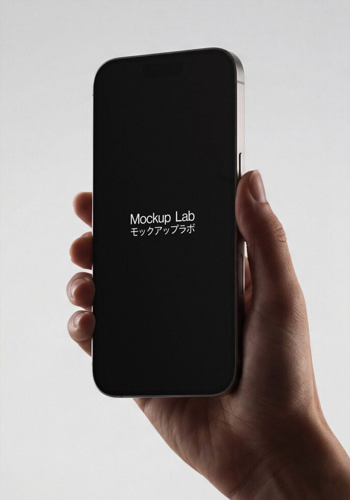 Hand holding smartphone with black screen displaying Mockup Lab text