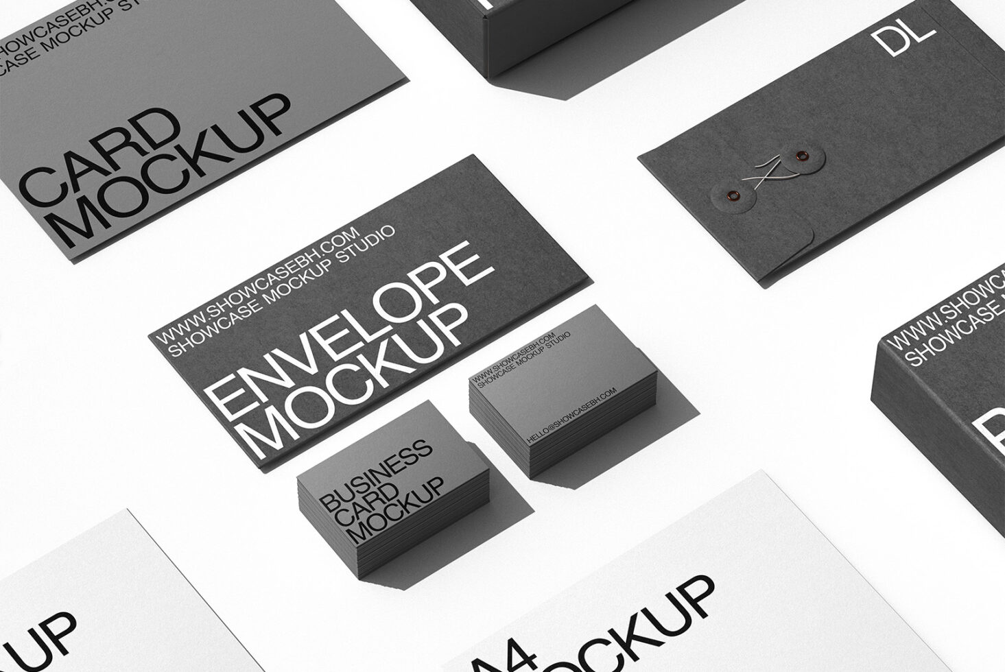 Flat lay of charcoal stationery mockups including cards, envelopes, business cards, folders