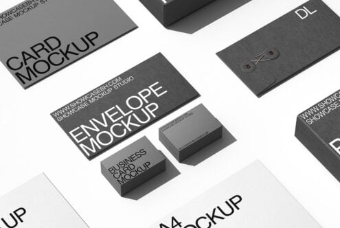 Flat lay of charcoal stationery mockups including cards, envelopes, business cards, folders