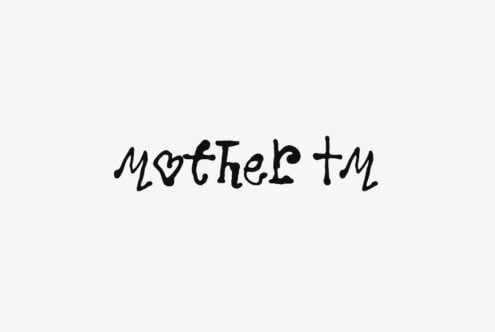 Handwritten script font saying Mother with small heart symbol