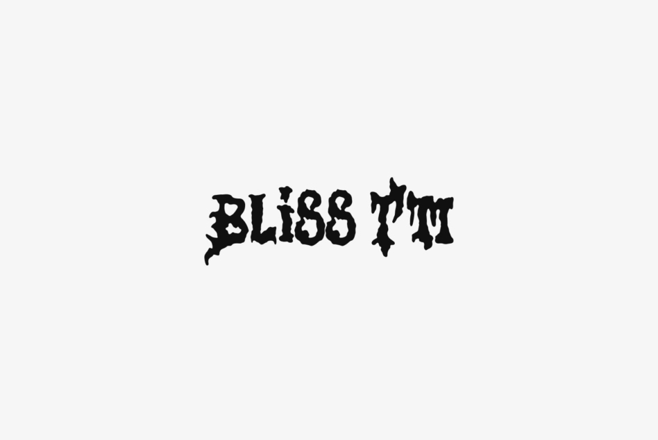 Bliss Twit distressed black typeface on light beige background for display
