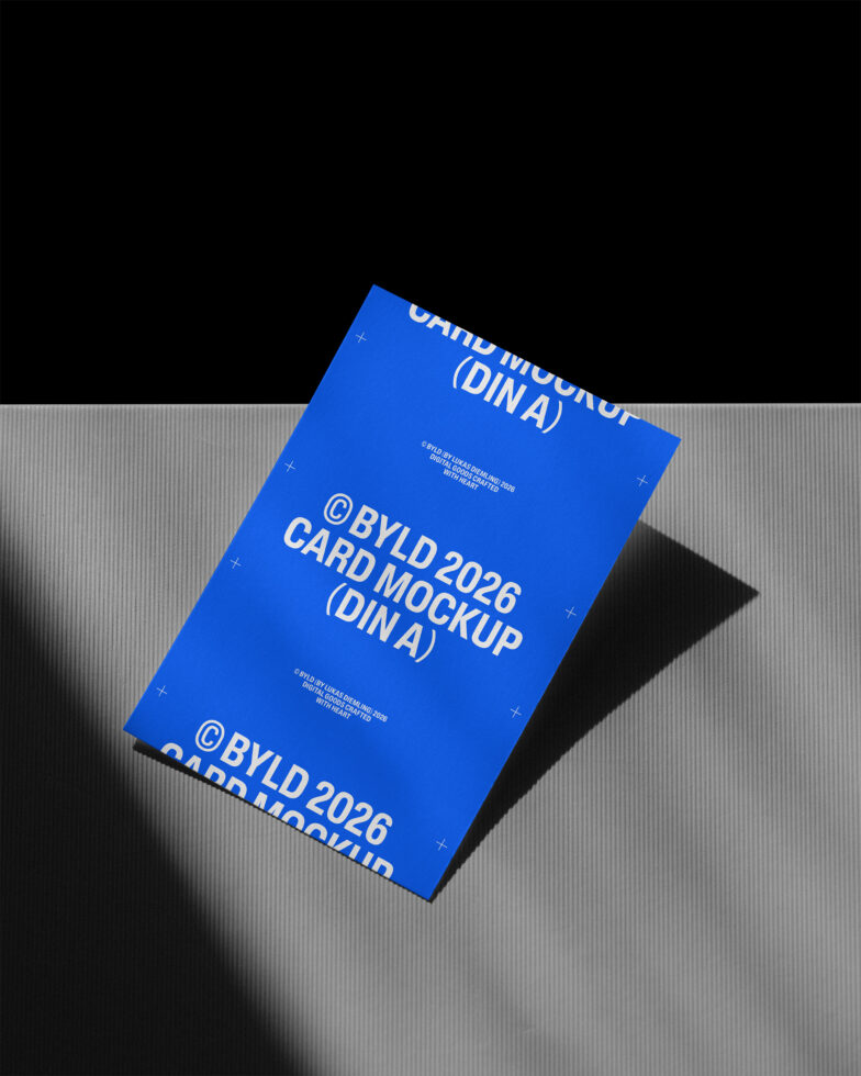 Stacked blue DIN A postcards with white text on neutral grey ribbed surface