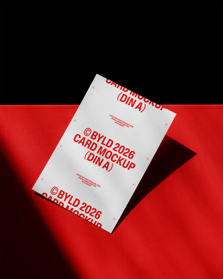 Stacked white DIN A postcards with red text on vivid red corrugated backdrop