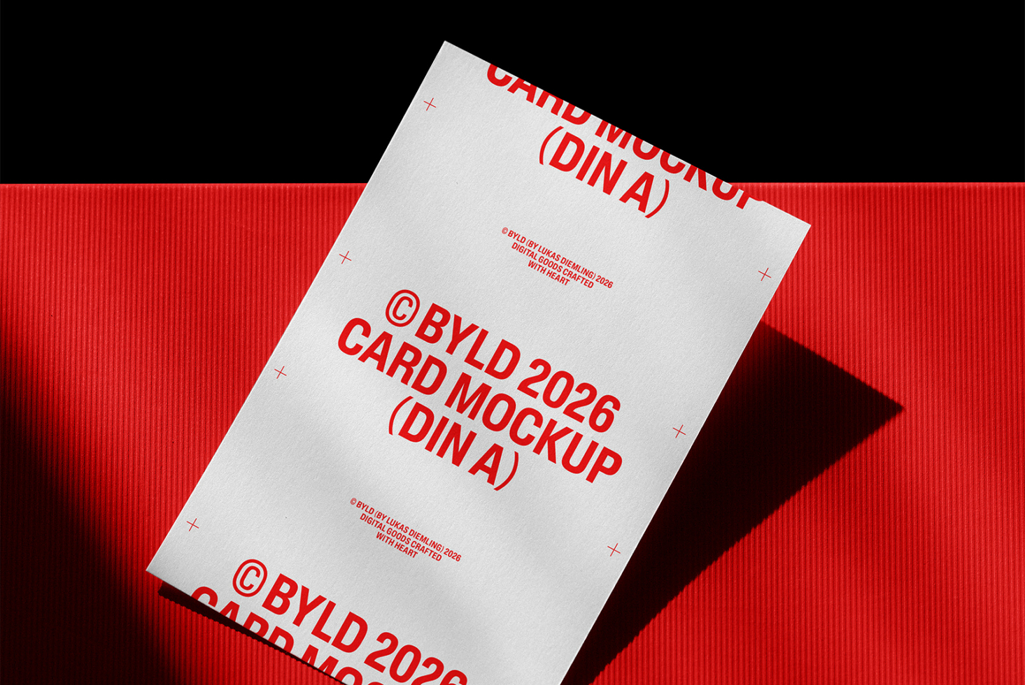 DIN A4 card mockup with red text on white background against red backdrop