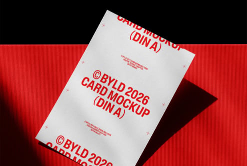 DIN A4 card mockup with red text on white background against red backdrop