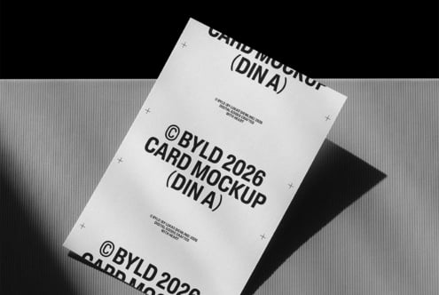 DIN A4 card mockup with black text on white background, angled shot