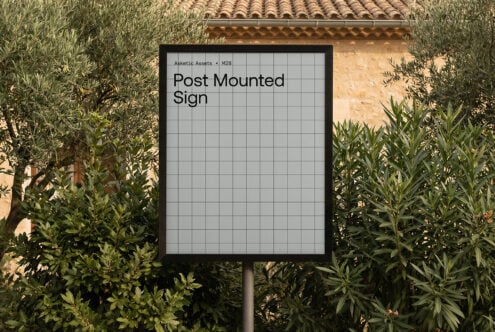 Black-framed post mounted sign with grid pattern in Mediterranean garden setting