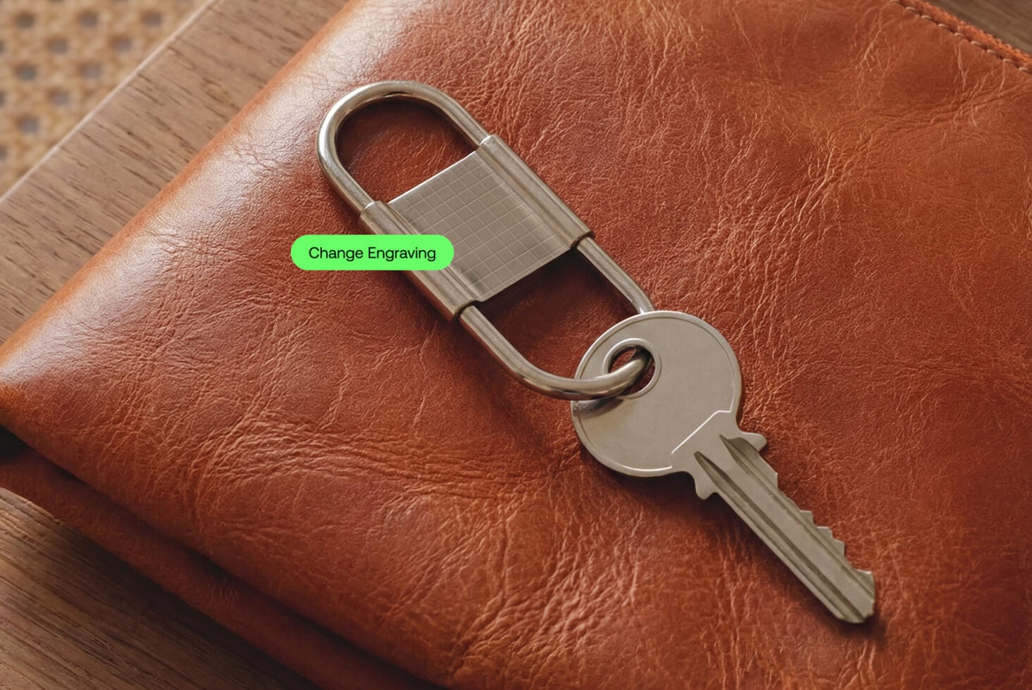 Leather keychain with metal padlock on cognac wallet, editable engraving area