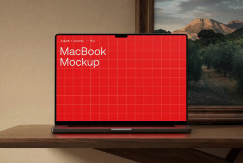 MacBook mockup with red glowing screen, landscape view behind device