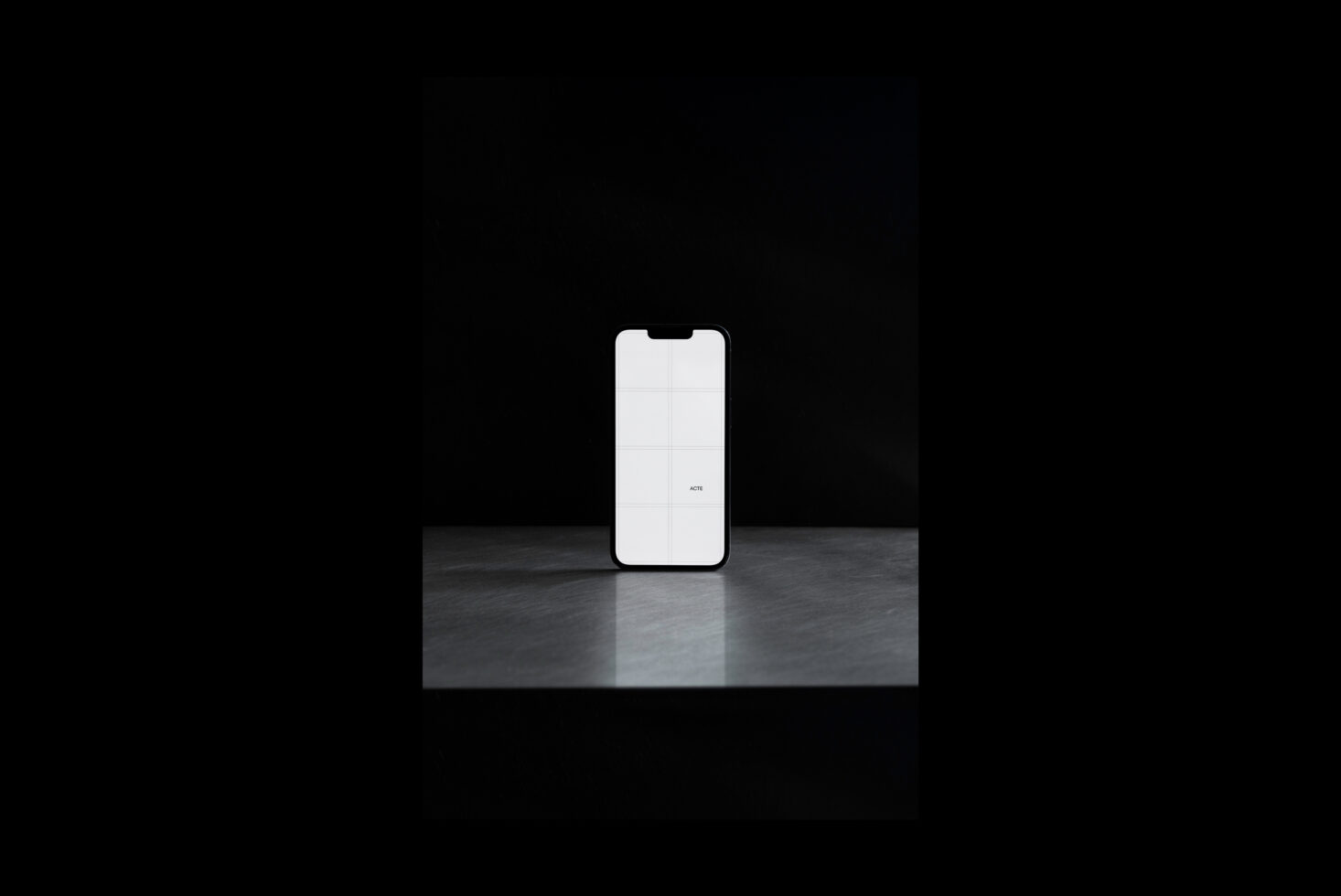 White smartphone mockup centered on dark textured metal platform, minimal setup