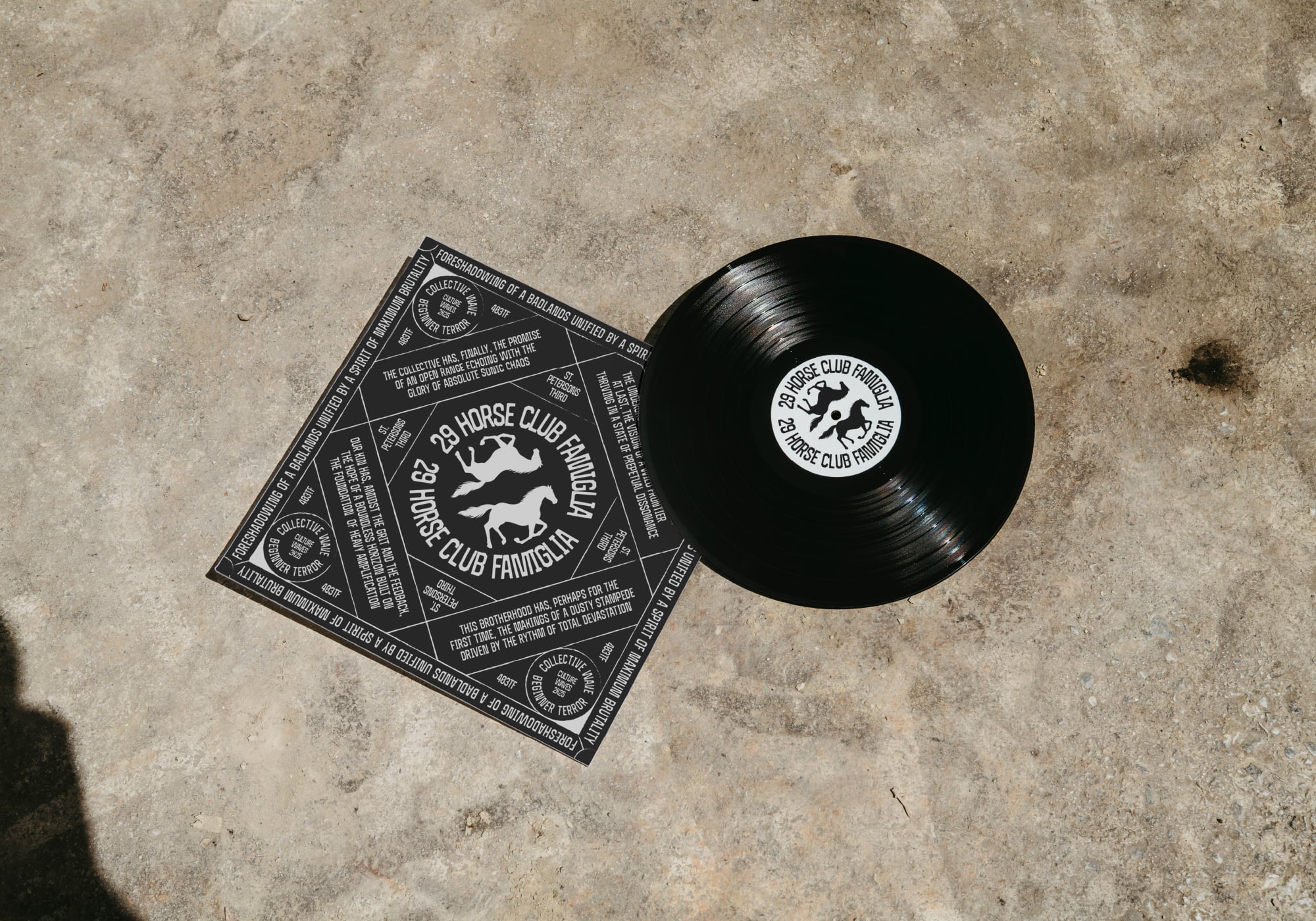 Vinyl record with horse club logo next to printed album artwork on concrete