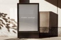 Square billboard mockup with neutral gray screen in bright sunlight