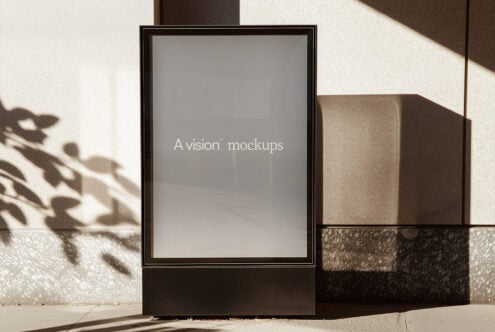 Square billboard mockup with neutral gray screen in bright sunlight