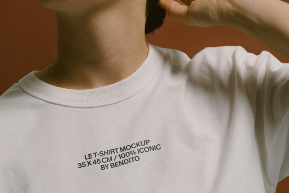 Cream t-shirt mockup with small black text printed on front chest area