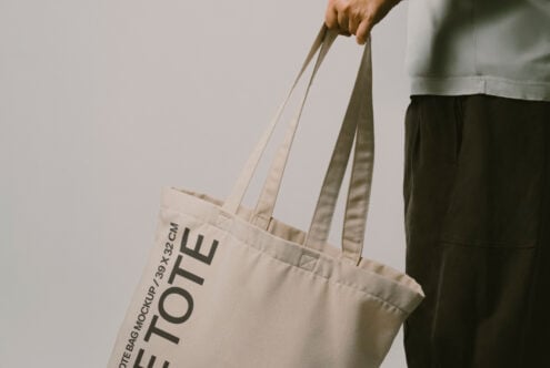 Close up of natural canvas tote bag with Let Tote Bag Mockup text visible on front panel