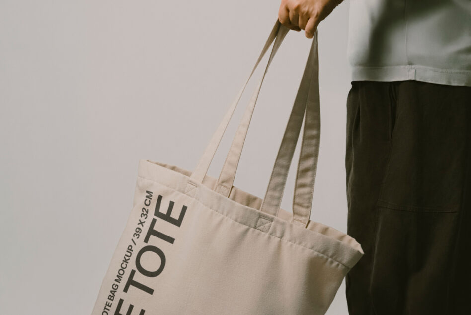 Close up of natural canvas tote bag with Let Tote Bag Mockup text visible on front panel