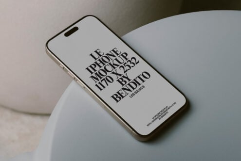 White iPhone 14 Pro mockup positioned on soft sculptural pottery form